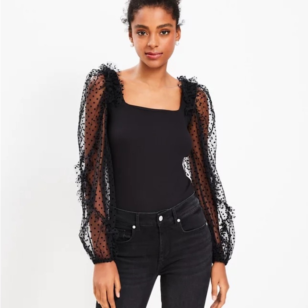 Black blouse with polka dot accent sleeves